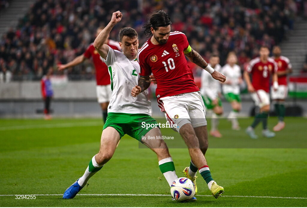16 November 2025; Dominik Szoboszlai of Hungary in action against Seamus Coleman of Republic of Ireland during the FIFA World Cup 2026 Group F Qualifier match between Hungary and Republic of Ireland at Puskás Aréna in Budapest, Hungary. Photo by Ben McShane/Sportsfile