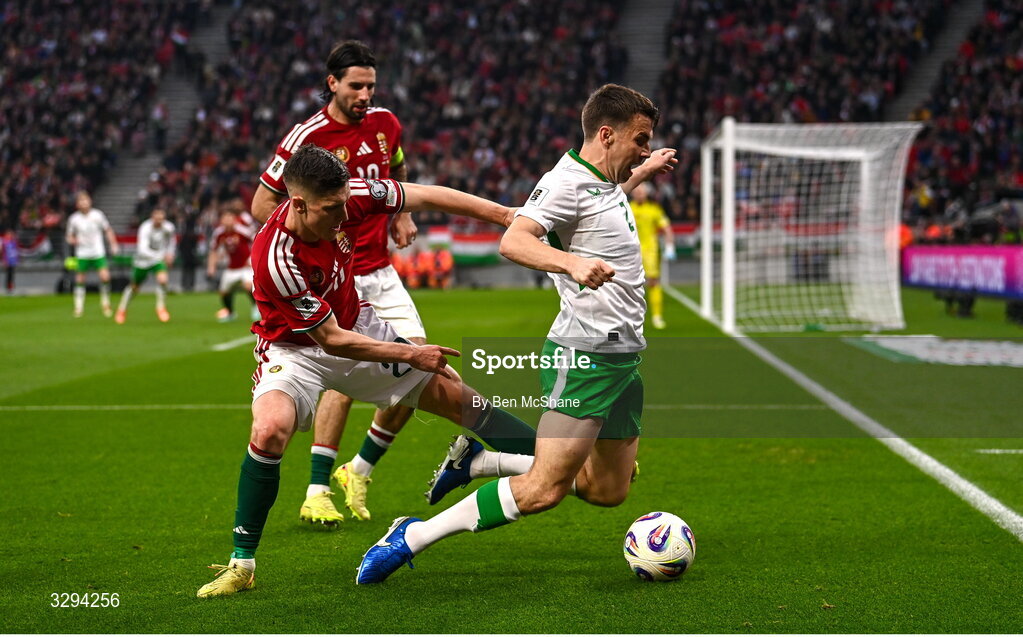 16 November 2025; Seamus Coleman of Republic of Ireland is tackled by Roland Sallai of Hungary during the FIFA World Cup 2026 Group F Qualifier match between Hungary and Republic of Ireland at Puskás Aréna in Budapest, Hungary. Photo by Ben McShane/Sportsfile