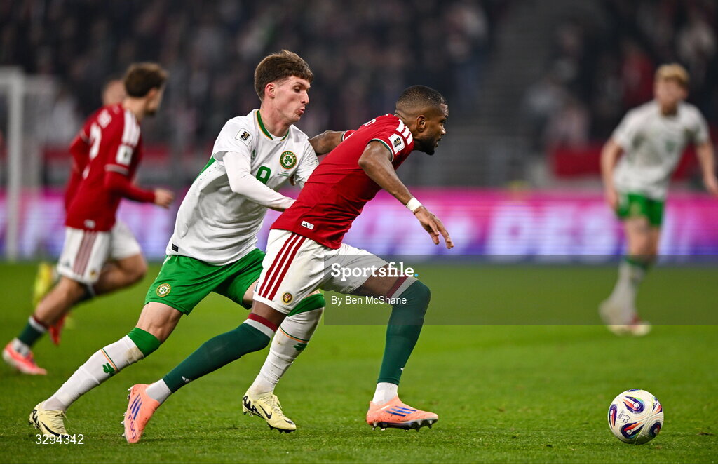 16 November 2025; Loïc Négo of Hungary in action against Johnny Kenny of Republic of Ireland during the FIFA World Cup 2026 Group F Qualifier match between Hungary and Republic of Ireland at Puskás Aréna in Budapest, Hungary. Photo by Ben McShane/Sportsfile