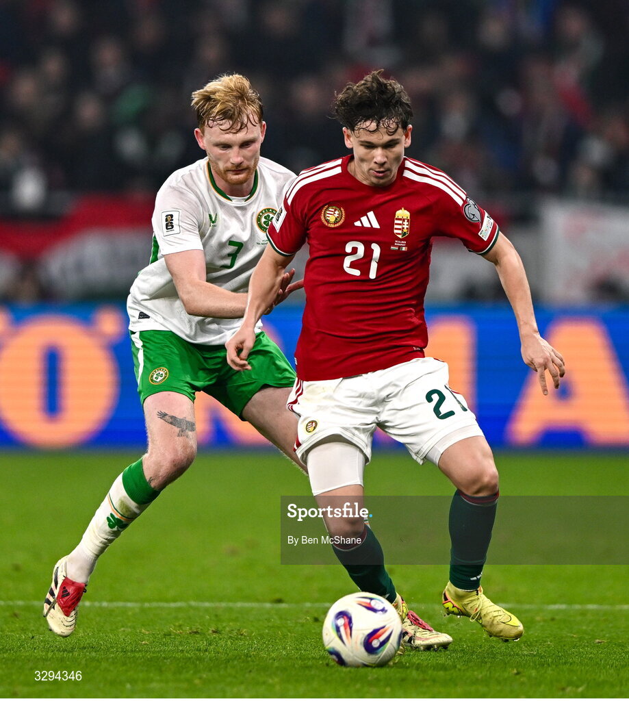 16 November 2025; Alex Tóth of Hungary in action against Liam Scales of Republic of Ireland during the FIFA World Cup 2026 Group F Qualifier match between Hungary and Republic of Ireland at Puskás Aréna in Budapest, Hungary. Photo by Ben McShane/Sportsfile
