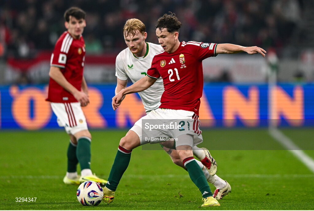 16 November 2025; Alex Tóth of Hungary in action against Liam Scales of Republic of Ireland during the FIFA World Cup 2026 Group F Qualifier match between Hungary and Republic of Ireland at Puskás Aréna in Budapest, Hungary. Photo by Ben McShane/Sportsfile