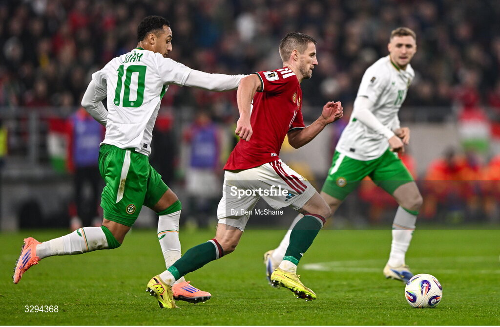 16 November 2025; Zsolt Nagy of Hungary in action against Adam Idah of Republic of Ireland during the FIFA World Cup 2026 Group F Qualifier match between Hungary and Republic of Ireland at Puskás Aréna in Budapest, Hungary. Photo by Ben McShane/Sportsfile