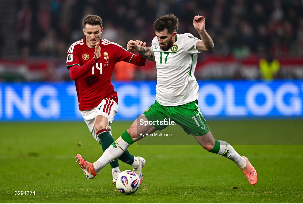 16 November 2025; Ryan Manning of Republic of Ireland in action against Bendegúz Bolla of Hungary during the FIFA World Cup 2026 Group F Qualifier match between Hungary and Republic of Ireland at Puskás Aréna in Budapest, Hungary. Photo by Ben McShane/Sportsfile