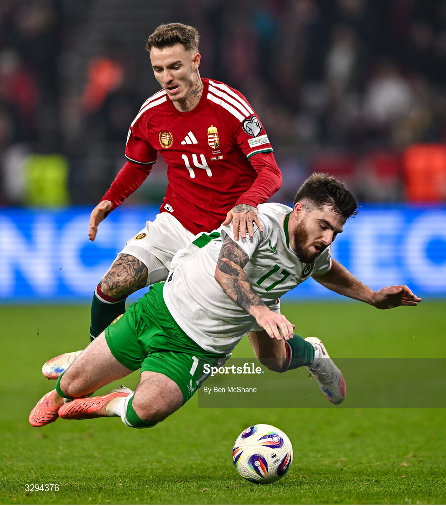 16 November 2025; Ryan Manning of Republic of Ireland in action against Bendegúz Bolla of Hungary during the FIFA World Cup 2026 Group F Qualifier match between Hungary and Republic of Ireland at Puskás Aréna in Budapest, Hungary. Photo by Ben McShane/Sportsfile