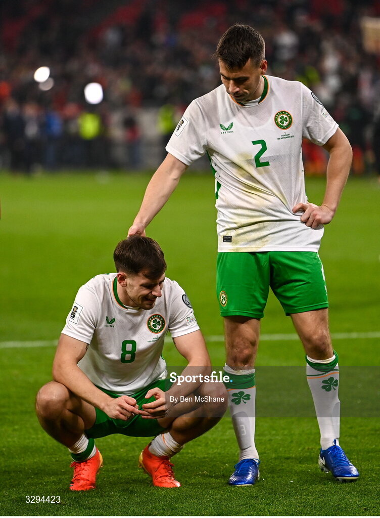 16 November 2025; Jayson Molumby, left, and Seamus Coleman of Republic of Ireland celebrate after the FIFA World Cup 2026 Group F Qualifier match between Hungary and Republic of Ireland at Puskás Aréna in Budapest, Hungary. Photo by Ben McShane/Sportsfile