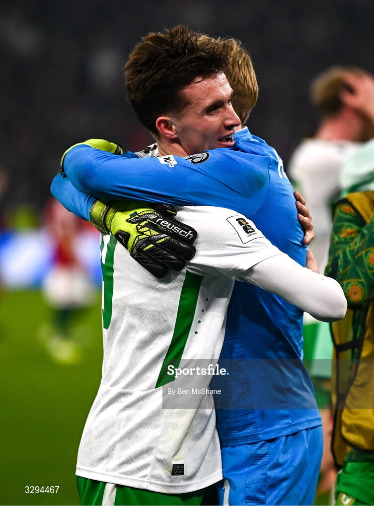 16 November 2025; Johnny Kenny, left, and Republic of Ireland goalkeeper Caoimhin Kelleher celebrate after the FIFA World Cup 2026 Group F Qualifier match between Hungary and Republic of Ireland at Puskás Aréna in Budapest, Hungary. Photo by Ben McShane/Sportsfile