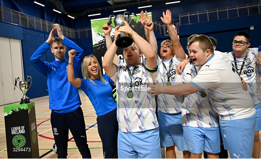 16 November 2025; Waterford captain Sean Toolin lifts the championship cup after his side's victory at LOI Cairdeas Cup Festival at the National Indoor Arena on the Sport Ireland Campus in Dublin. Photo by Seb Daly/Sportsfile