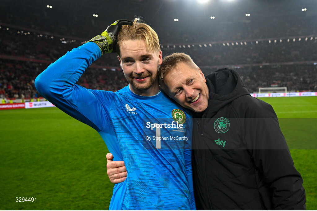 16 November 2025; Republic of Ireland head coach Heimir Hallgrimsson and Republic of Ireland goalkeeper Caoimhin Kelleher celebrate after the FIFA World Cup 2026 Group F Qualifier match between Hungary and Republic of Ireland at Puskás Aréna in Budapest, Hungary. Photo by Stephen McCarthy/Sportsfile