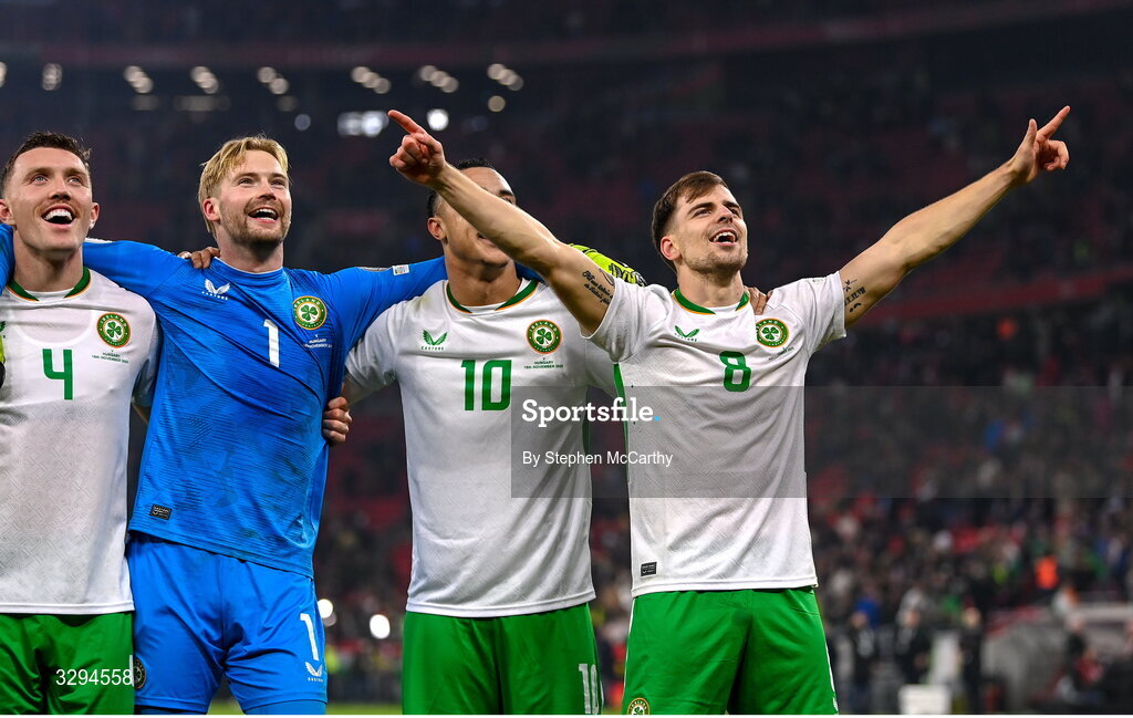 16 November 2025; Republic of Ireland players, from left, Dara O'Shea, Caoimhin Kelleher, Adam Idah and Jayson Molumby celebrate after the FIFA World Cup 2026 Group F Qualifier match between Hungary and Republic of Ireland at Puskás Aréna in Budapest, Hungary. Photo by Stephen McCarthy/Sportsfile