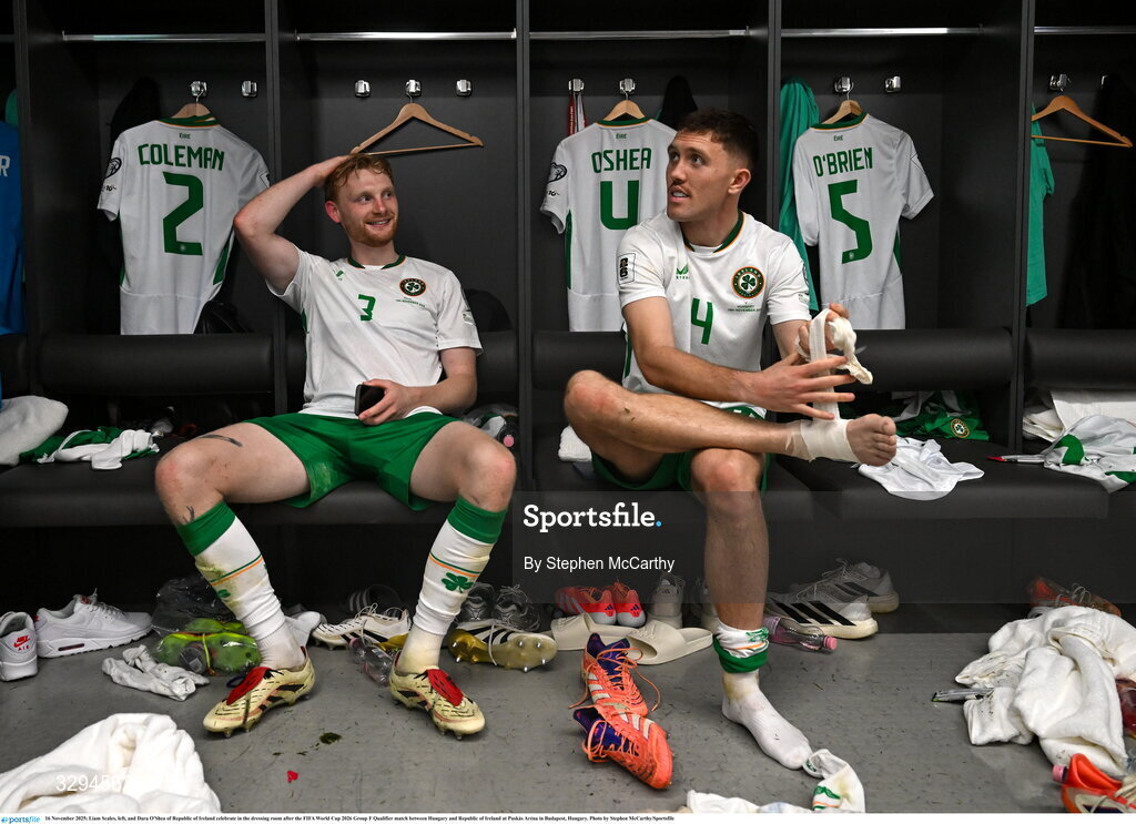 16 November 2025; Liam Scales, left, and Dara O'Shea of Republic of Ireland celebrate in the dressing room after the FIFA World Cup 2026 Group F Qualifier match between Hungary and Republic of Ireland at Puskás Aréna in Budapest, Hungary. Photo by Stephen McCarthy/Sportsfile