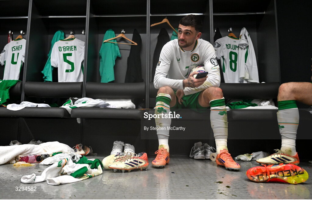 16 November 2025; Troy Parrott of Republic of Ireland celebrates with the match ball in the dressing room after scoring a hat-trick in the FIFA World Cup 2026 Group F Qualifier match between Hungary and Republic of Ireland at Puskás Aréna in Budapest, Hungary. Photo by Stephen McCarthy/Sportsfile