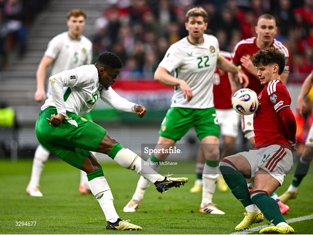 16 November 2025; Chiedozie Ogbene of Republic of Ireland and Milos Kerkez of Hungary during the FIFA World Cup 2026 Group F Qualifier match between Hungary and Republic of Ireland at Puskás Aréna in Budapest, Hungary. Photo by Ben McShane/Sportsfile