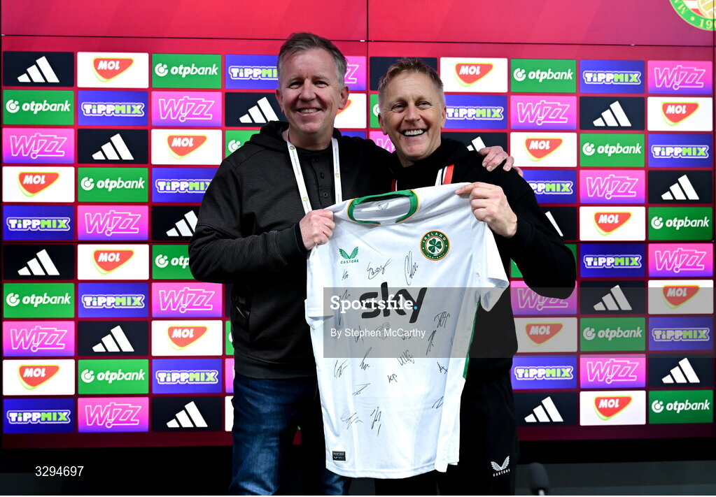 16 November 2025; Republic of Ireland head coach Heimir Hallgrimsson presents a signed Republic of Ireland jersey to retiring RTÉ sport journalist Ed Leahy after the FIFA World Cup 2026 Group F Qualifier match between Hungary and Republic of Ireland at Puskás Aréna in Budapest, Hungary. Photo by Stephen McCarthy/Sportsfile