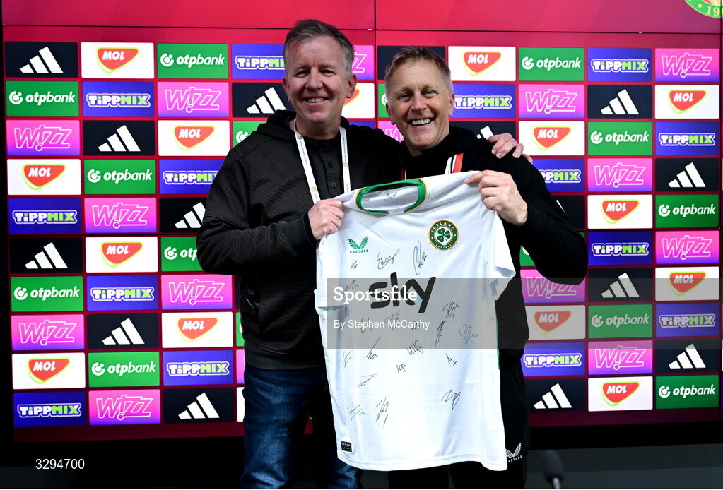 16 November 2025; Republic of Ireland head coach Heimir Hallgrimsson presents a signed Republic of Ireland jersey to retiring RTÉ sport journalist Ed Leahy after the FIFA World Cup 2026 Group F Qualifier match between Hungary and Republic of Ireland at Puskás Aréna in Budapest, Hungary. Photo by Stephen McCarthy/Sportsfile