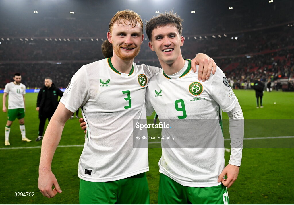 16 November 2025; Republic of Ireland's Liam Scales, left, and Johnny Kenny celebrate after the FIFA World Cup 2026 Group F Qualifier match between Hungary and Republic of Ireland at Puskás Aréna in Budapest, Hungary. Photo by Stephen McCarthy/Sportsfile