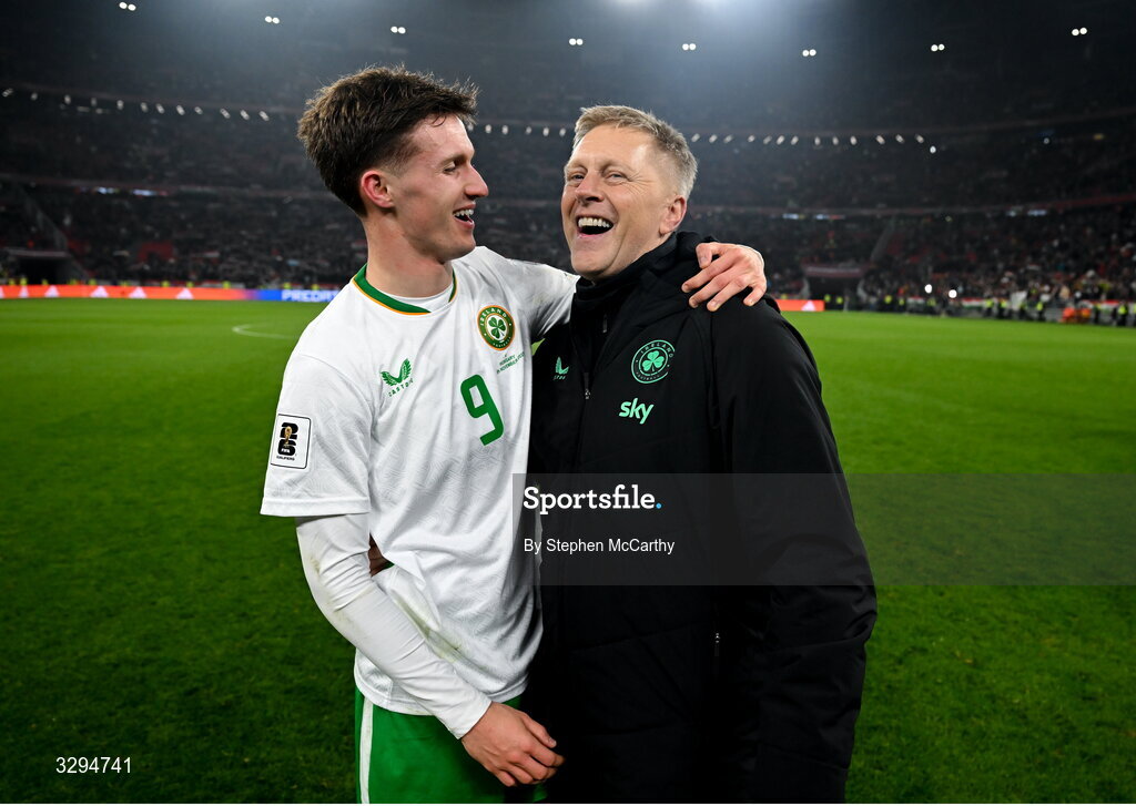 16 November 2025; Republic of Ireland head coach Heimir Hallgrimsson and Johnny Kenny celebrate after the FIFA World Cup 2026 Group F Qualifier match between Hungary and Republic of Ireland at Puskás Aréna in Budapest, Hungary. Photo by Stephen McCarthy/Sportsfile
