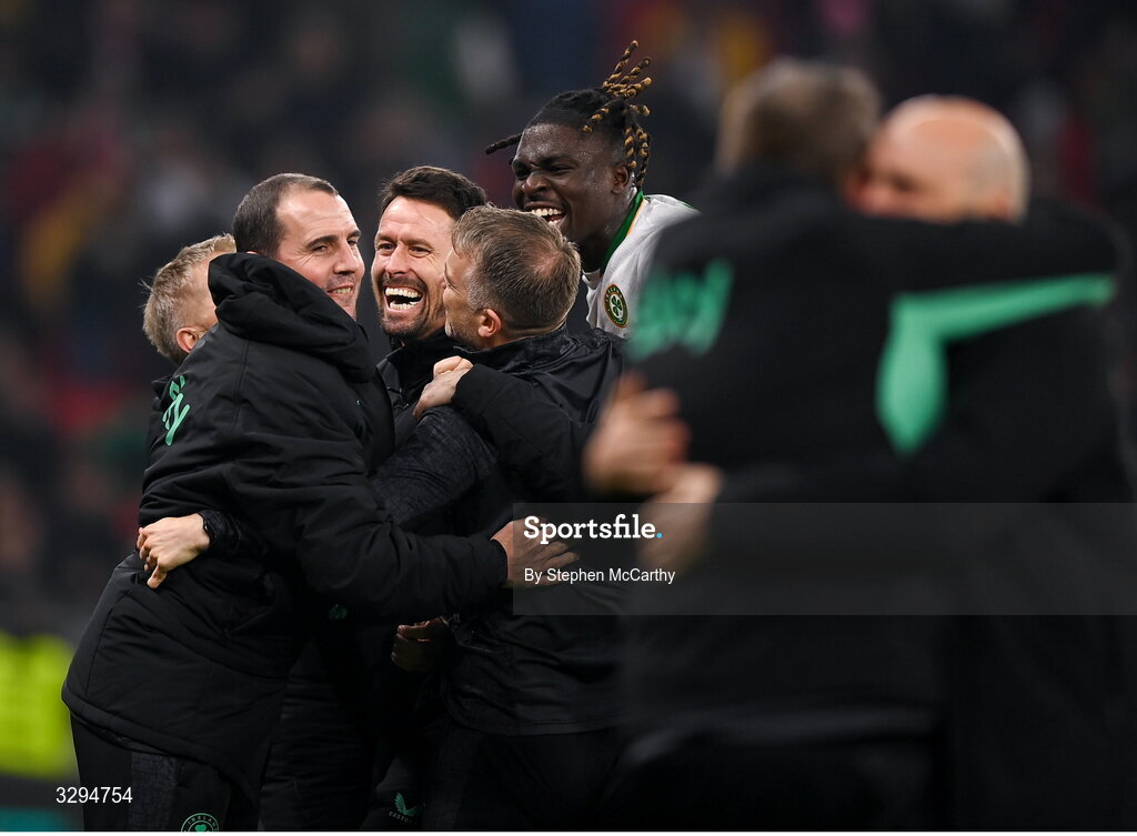 16 November 2025; Republic of Ireland assistant coach Paddy McCarthy, centre, assistant head coach John O'Shea, left, and Festy Ebosele, right, celebrate after the FIFA World Cup 2026 Group F Qualifier match between Hungary and Republic of Ireland at Puskás Aréna in Budapest, Hungary. Photo by Stephen McCarthy/Sportsfile