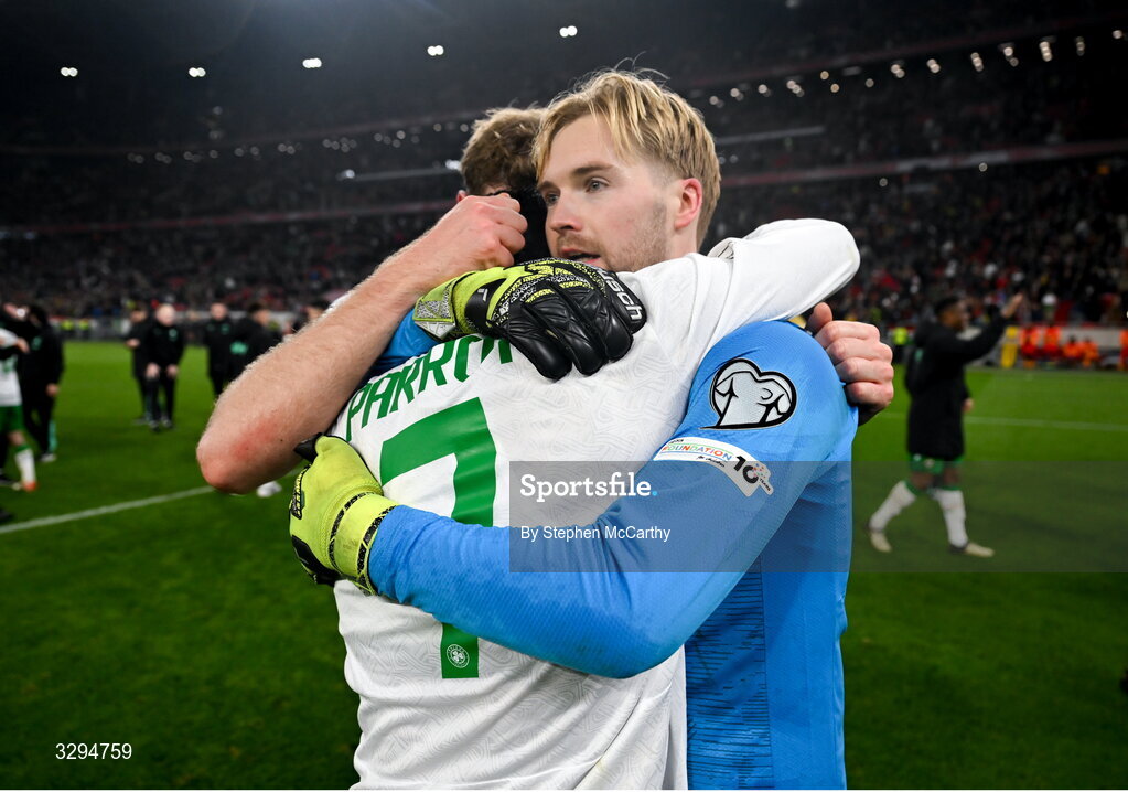 16 November 2025; Republic of Ireland goalkeeper Caoimhin Kelleher and Troy Parrott celebrate after the FIFA World Cup 2026 Group F Qualifier match between Hungary and Republic of Ireland at Puskás Aréna in Budapest, Hungary. Photo by Stephen McCarthy/Sportsfile