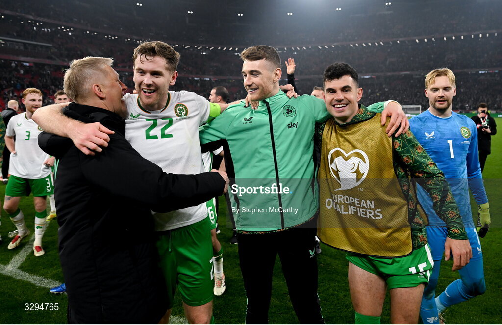 16 November 2025; Republic of Ireland head coach Heimir Hallgrimsson, left, celebrates with players, from left, Nathan Collins, Mark Travers and John Egan after the FIFA World Cup 2026 Group F Qualifier match between Hungary and Republic of Ireland at Puskás Aréna in Budapest, Hungary. Photo by Stephen McCarthy/Sportsfile