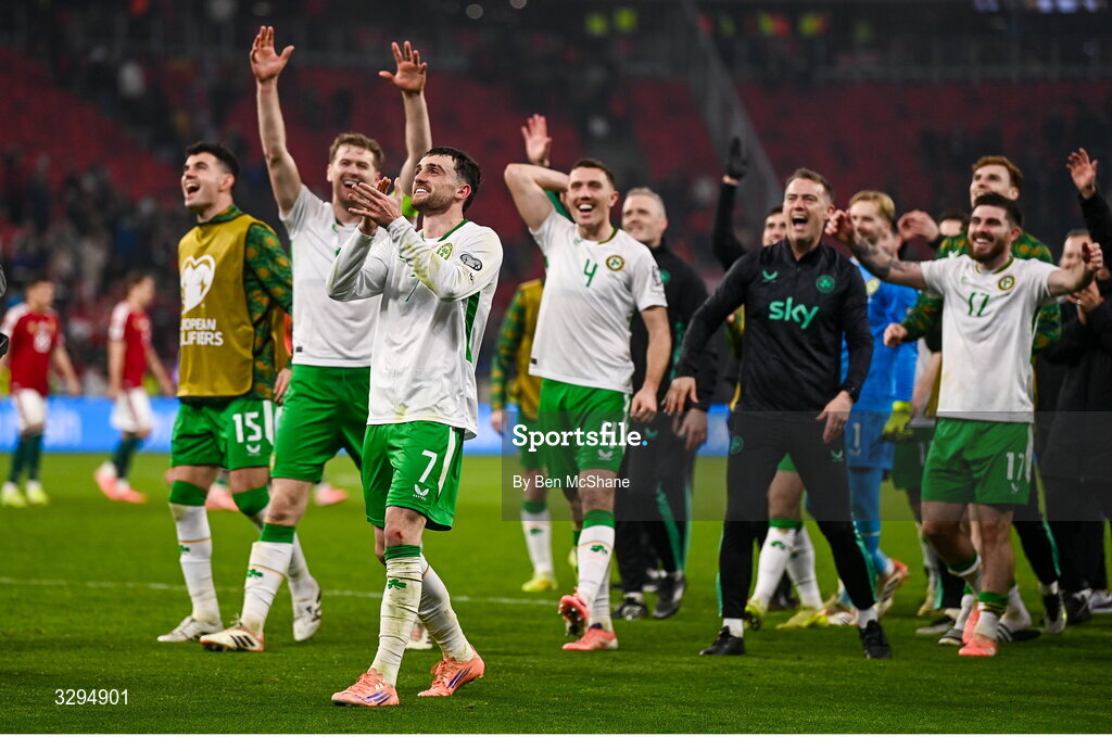 16 November 2025; Republic of Ireland players, including Troy Parrott, centre, celebrate after the FIFA World Cup 2026 Group F Qualifier match between Hungary and Republic of Ireland at Puskás Aréna in Budapest, Hungary. Photo by Ben McShane/Sportsfile