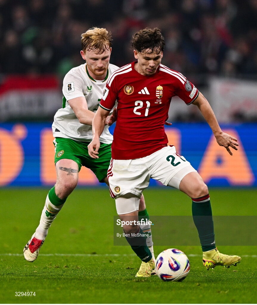 16 November 2025; Alex Tóth of Hungary and Liam Scales of Republic of Ireland during the FIFA World Cup 2026 Group F Qualifier match between Hungary and Republic of Ireland at Puskás Aréna in Budapest, Hungary. Photo by Ben McShane/Sportsfile