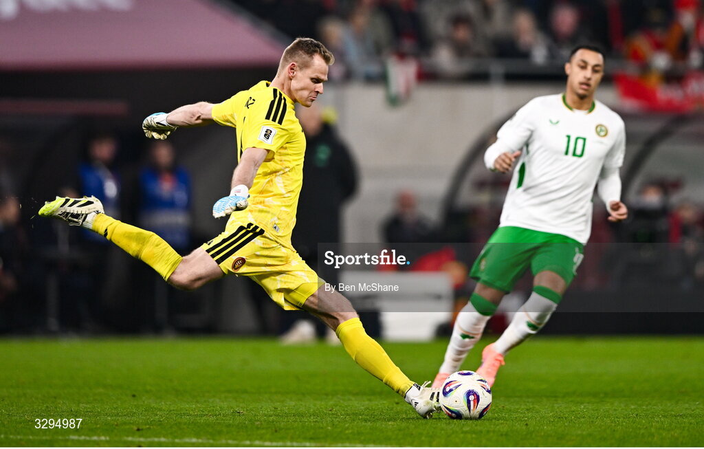 16 November 2025; Hungary goalkeeper Dénes Dibusz and Adam Idah of Republic of Ireland during the FIFA World Cup 2026 Group F Qualifier match between Hungary and Republic of Ireland at Puskás Aréna in Budapest, Hungary. Photo by Ben McShane/Sportsfile