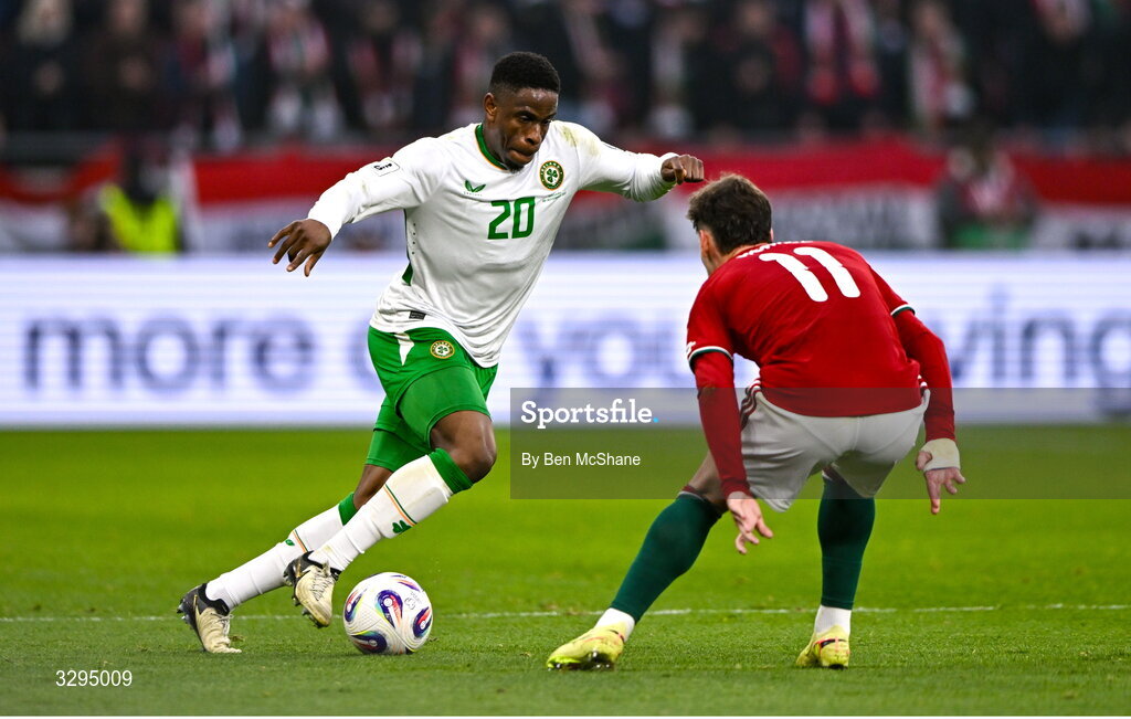 16 November 2025; Chiedozie Ogbene of Republic of Ireland and Milos Kerkez of Hungary during the FIFA World Cup 2026 Group F Qualifier match between Hungary and Republic of Ireland at Puskás Aréna in Budapest, Hungary. Photo by Ben McShane/Sportsfile