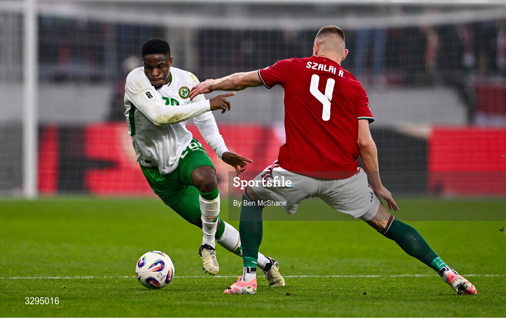 16 November 2025; Chiedozie Ogbene of Republic of Ireland and Attila Szalai of Hungary during the FIFA World Cup 2026 Group F Qualifier match between Hungary and Republic of Ireland at Puskás Aréna in Budapest, Hungary. Photo by Ben McShane/Sportsfile