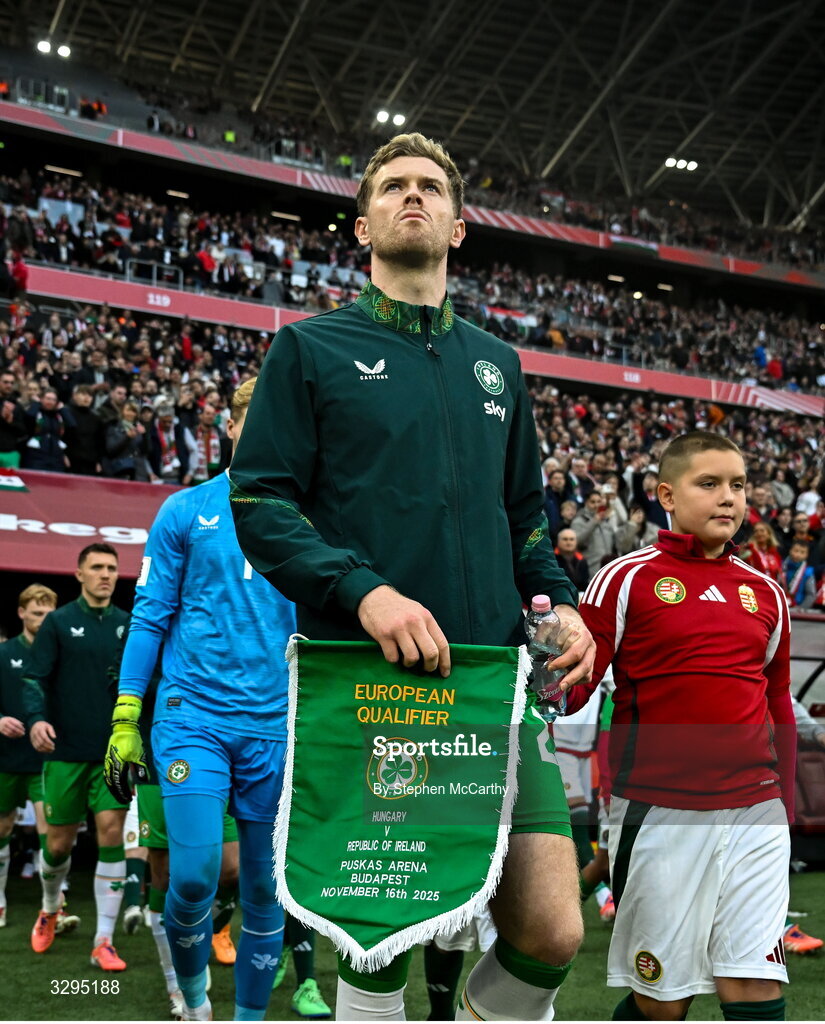 16 November 2025; Republic of Ireland captain Nathan Collins leads his side out before the FIFA World Cup 2026 Group F Qualifier match between Hungary and Republic of Ireland at Puskás Aréna in Budapest, Hungary. Photo by Stephen McCarthy/Sportsfile