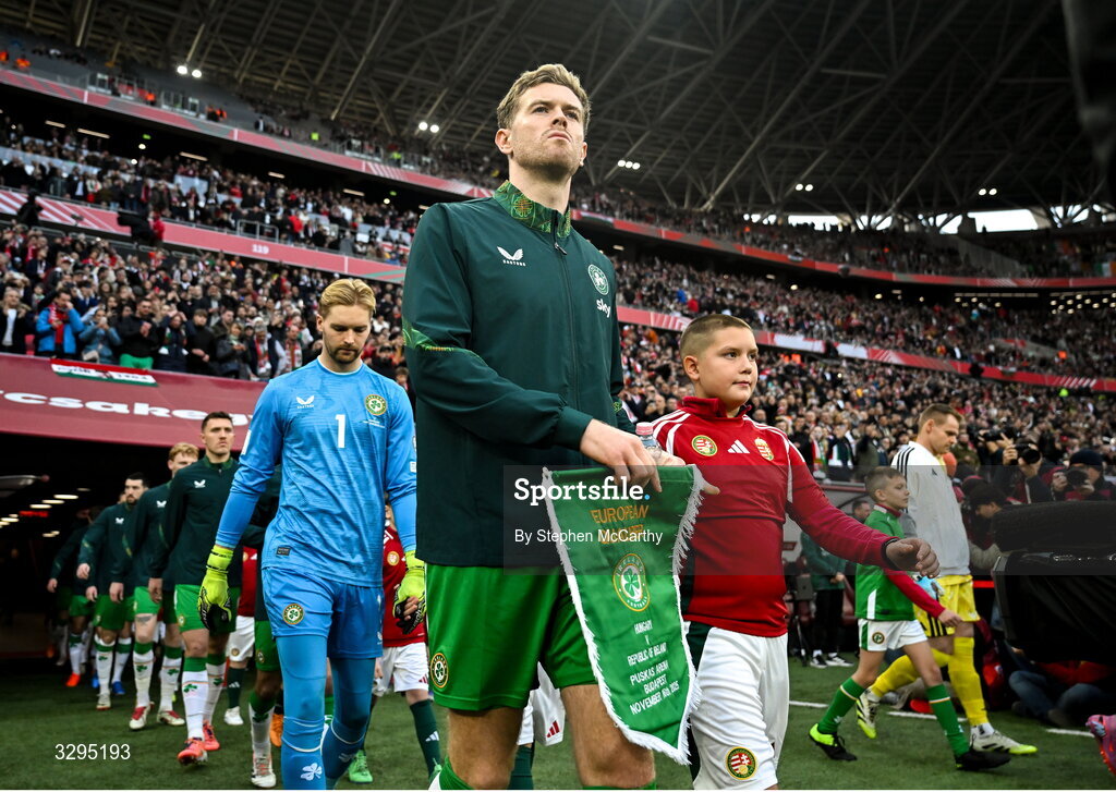 16 November 2025; Republic of Ireland captain Nathan Collins leads his side out before the FIFA World Cup 2026 Group F Qualifier match between Hungary and Republic of Ireland at Puskás Aréna in Budapest, Hungary. Photo by Stephen McCarthy/Sportsfile