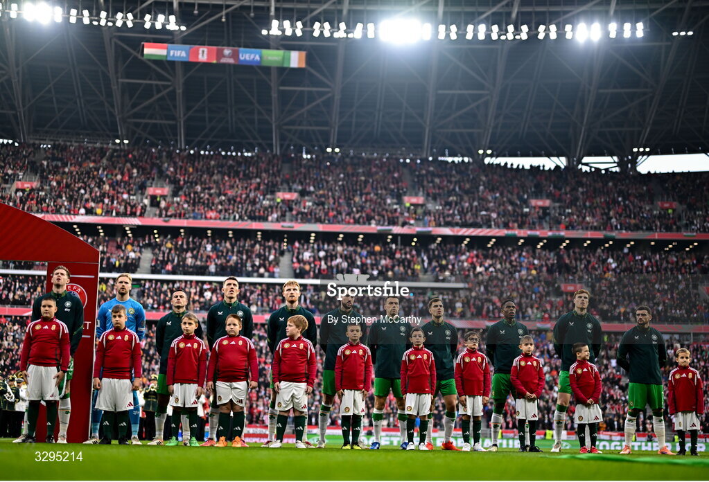 16 November 2025; Republic of Ireland players, from left, Nathan Collins, goalkeeper Caoimhin Kelleher, Josh Cullen, Dara O'Shea, Liam Scales, Finn Azaz, Seamus Coleman, Jayson Molumby, Chiedozie Ogbene, Jake O'Brien and Troy Parrott stand for the playing of the National Anthem before the FIFA World Cup 2026 Group F Qualifier match between Hungary and Republic of Ireland at Puskás Aréna in Budapest, Hungary. Photo by Stephen McCarthy/Sportsfile