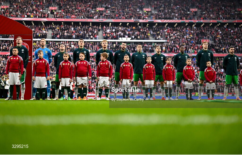 16 November 2025; Republic of Ireland players, from left, Nathan Collins, goalkeeper Caoimhin Kelleher, Josh Cullen, Dara O'Shea, Liam Scales, Finn Azaz, Seamus Coleman, Jayson Molumby, Chiedozie Ogbene, Jake O'Brien and Troy Parrott stand for the playing of the National Anthem before the FIFA World Cup 2026 Group F Qualifier match between Hungary and Republic of Ireland at Puskás Aréna in Budapest, Hungary. Photo by Stephen McCarthy/Sportsfile