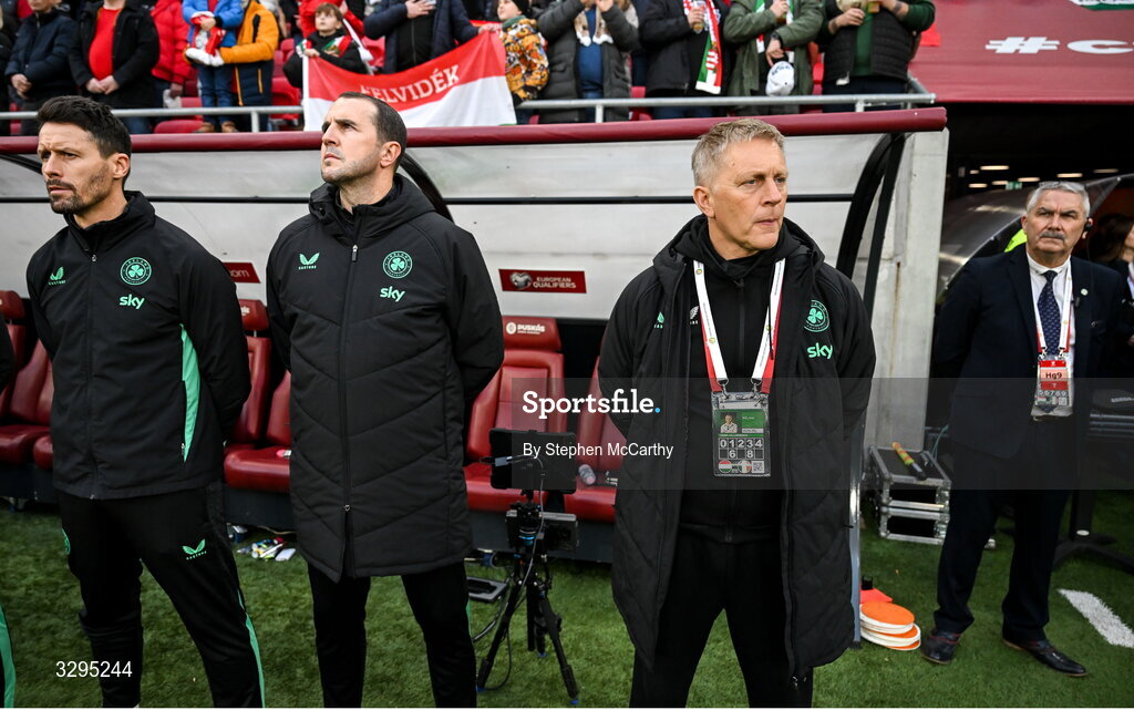 16 November 2025; Republic of Ireland staff, from left, assistant coach Paddy McCarthy, assistant head coach John O'Shea, head coach Heimir Hallgrimsson and team security Noel O’Flynn before the FIFA World Cup 2026 Group F Qualifier match between Hungary and Republic of Ireland at Puskás Aréna in Budapest, Hungary. Photo by Stephen McCarthy/Sportsfile