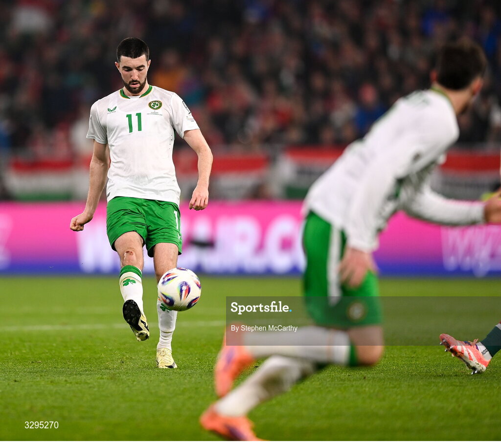 16 November 2025; Finn Azaz of Republic of Ireland plays a pass in the build up the team-mate Troy Parrott, right, scoring their second goal during the FIFA World Cup 2026 Group F Qualifier match between Hungary and Republic of Ireland at Puskás Aréna in Budapest, Hungary. Photo by Stephen McCarthy/Sportsfile