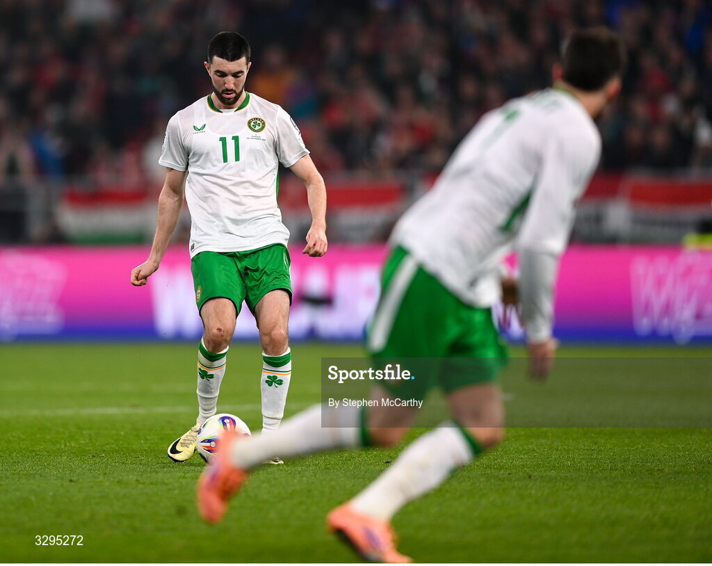 16 November 2025; Finn Azaz of Republic of Ireland plays a pass in the build up the team-mate Troy Parrott, right, scoring their second goal during the FIFA World Cup 2026 Group F Qualifier match between Hungary and Republic of Ireland at Puskás Aréna in Budapest, Hungary. Photo by Stephen McCarthy/Sportsfile