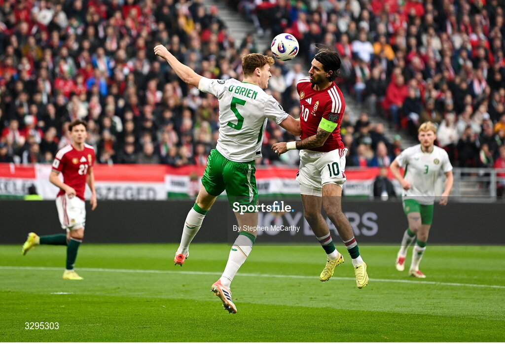 16 November 2025; Jake O'Brien of Republic of Ireland in action against Dominik Szoboszlai of Hungary during the FIFA World Cup 2026 Group F Qualifier match between Hungary and Republic of Ireland at Puskás Aréna in Budapest, Hungary. Photo by Stephen McCarthy/Sportsfile