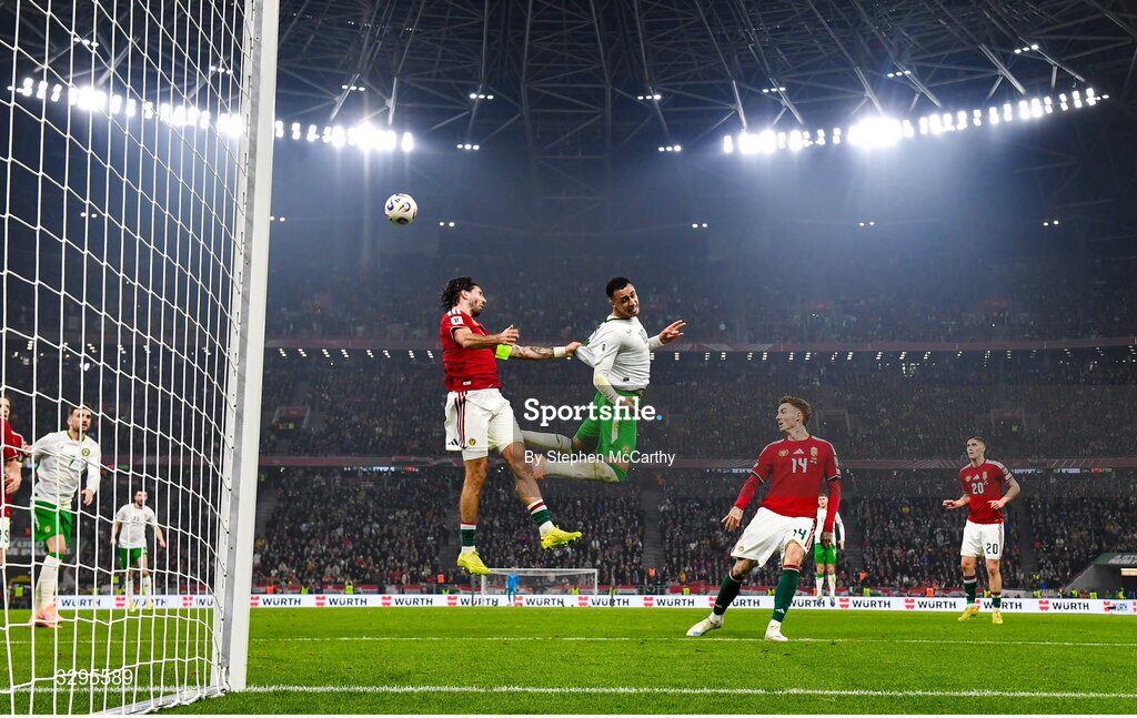 16 November 2025; Adam Idah of Republic of Ireland in action against Dominik Szoboszlai of Hungary during the FIFA World Cup 2026 Group F Qualifier match between Hungary and Republic of Ireland at Puskás Aréna in Budapest, Hungary. Photo by Stephen McCarthy/Sportsfile