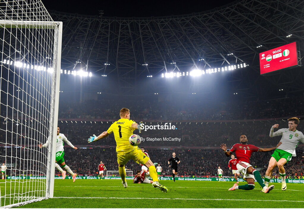 16 November 2025; Johnny Kenny of Republic of Ireland has a shot on goal saved by Hungary goalkeeper Dénes Dibusz during the FIFA World Cup 2026 Group F Qualifier match between Hungary and Republic of Ireland at Puskás Aréna in Budapest, Hungary. Photo by Stephen McCarthy/Sportsfile