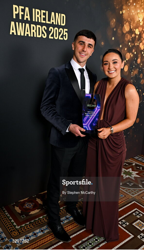 22 November 2025; Barry Coffey of Cobh Ramblers with Aoife Tynan and his PFA Ireland Men’s First Division Player of the Year 2025 award during the PFA Ireland Awards 2025 at The College Green Hotel in Dublin. Photo by Stephen McCarthy/Sportsfile