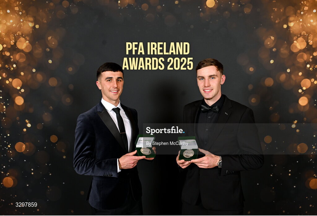 22 November 2025; Barry Coffey of Cobh Ramblers with his PFA Ireland Men's First Division Team of the Year 2025 medal, left, and Matt Healy of Shamrock Rovers with his PFA Ireland Men’s Premier Division Team of the Year 2025 medal during the PFA Ireland Awards 2025 at The College Green Hotel in Dublin. Photo by Stephen McCarthy/Sportsfile