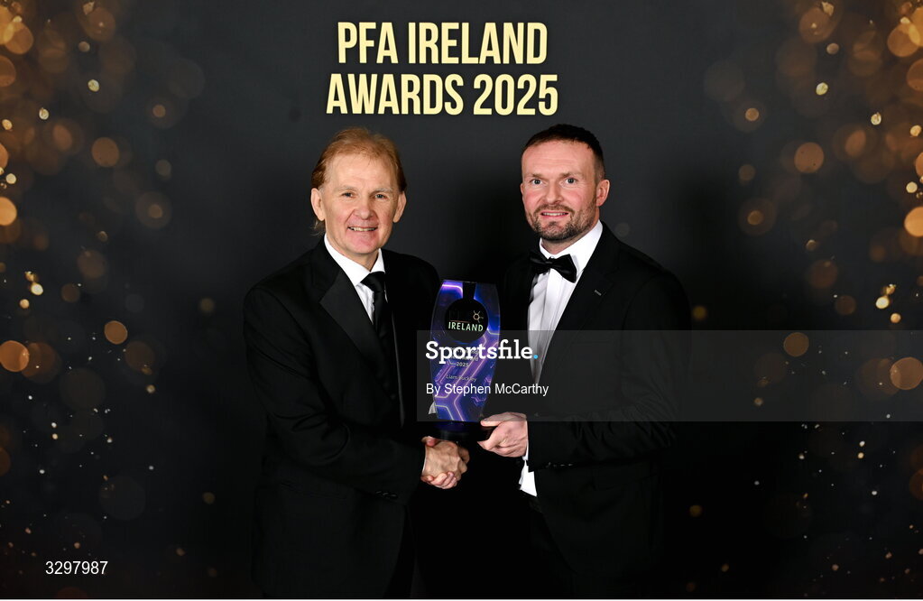 22 November 2025; Liam Buckley is presented with the PFA Ireland Merit Award 2025 by Conan Byrne during the PFA Ireland Awards 2025 at The College Green Hotel in Dublin. Photo by Stephen McCarthy/Sportsfile