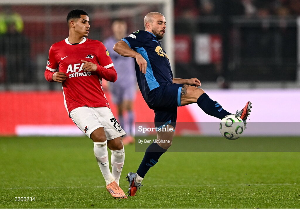 27 November 2025; Mark Coyle of Shelbourne in action against Wassim Bouziane of AZ Alkmaar during the UEFA Conference League 2025/26 league phase match between AZ Alkmaar and Shelbourne at AFAS Stadion in Alkmaar, Netherlands. Photo by Ben McShane/Sportsfile