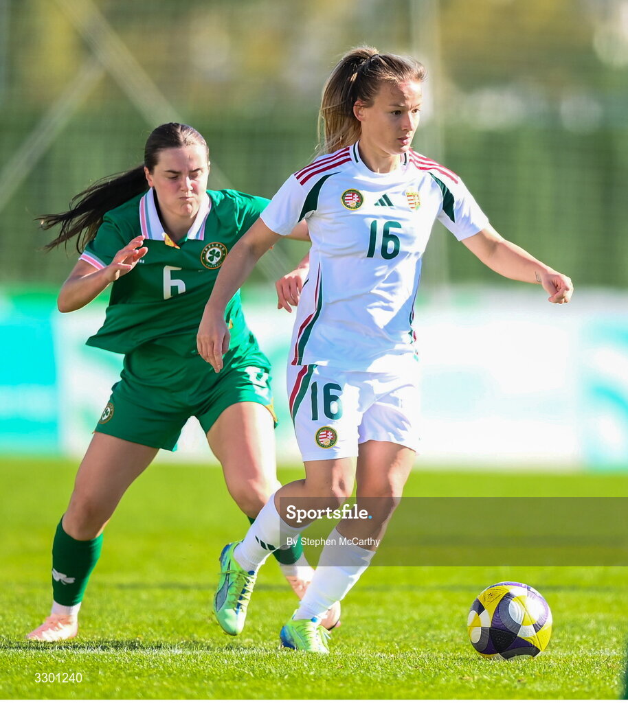 29 November 2025; Diana Csanyi of Hungary in action against Tyler Toland of Republic of Ireland during the women's international friendly match between Republic of Ireland and Hungary at Marbella Football Centre in Marbella, Spain. Photo by Stephen McCarthy/Sportsfile