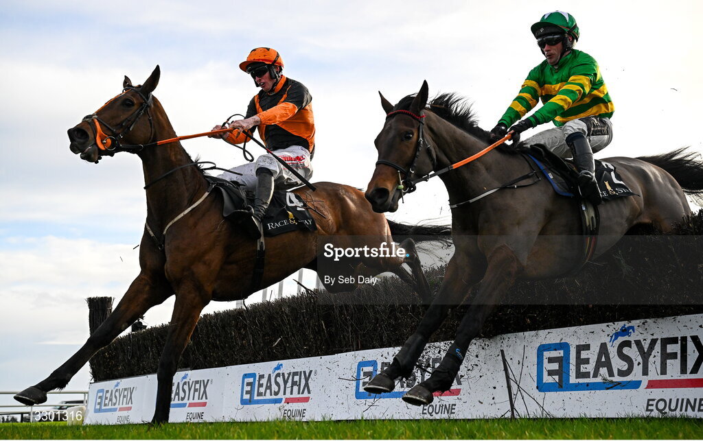 29 November 2025; True Testimony, left, with Joey Dunne up, jumps the last on their way to winning the Race And Stay Irish EBF Mares Handicap Steeplechase, from second place Uhavemeinstitches, right, with Simon Torrens up, during day one of the Fairyhouse Winter Festival at Fairyhouse Racecourse in Meath. Photo by Seb Daly/Sportsfile
