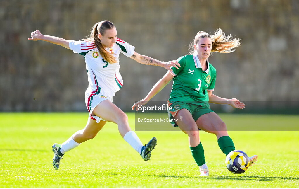 29 November 2025; Chloe Mustaki of Republic of Ireland in action against Emoke Papai of Hungary during the women's international friendly match between Republic of Ireland and Hungary at Marbella Football Centre in Marbella, Spain. Photo by Stephen McCarthy/Sportsfile