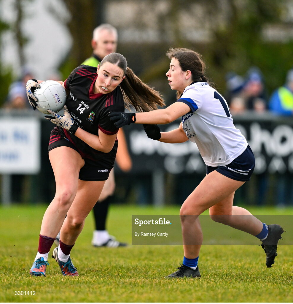 29 November 2025; Eimear Burke of Cromane in action against Laura Galligan of Cavan Gaels during the AIB All-Ireland Ladies Football Club Junior Club Championship semi-final match between Cavan Gaels of Cavan and Cromane of Kerry at Terry Coyle Park in Cavan. Photo by Ramsey Cardy/Sportsfile