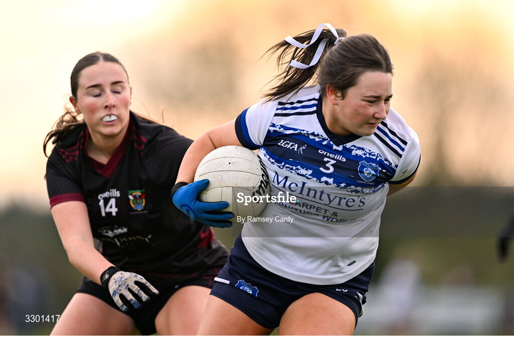 29 November 2025; Lauren Sheridan of Cavan Gaels in action against Eimear Burke of Cromane during the AIB All-Ireland Ladies Football Club Junior Club Championship semi-final match between Cavan Gaels of Cavan and Cromane of Kerry at Terry Coyle Park in Cavan. Photo by Ramsey Cardy/Sportsfile