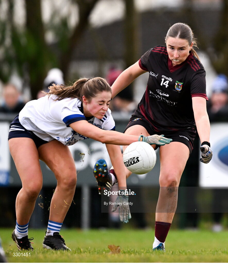 29 November 2025; Sarah Clarke of Cavan Gaels blocks a shot by Eimear Burke of Cromane during the AIB All-Ireland Ladies Football Club Junior Club Championship semi-final match between Cavan Gaels of Cavan and Cromane of Kerry at Terry Coyle Park in Cavan. Photo by Ramsey Cardy/Sportsfile