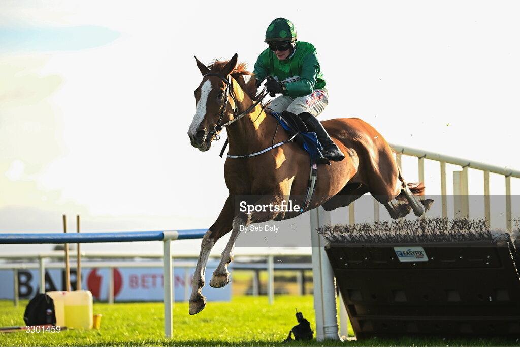 29 November 2025; Talk The Talk, with Sam Ewing up, jumps the last on their way to winning the Jack McInerney Memorial Hurdle during day one of the Fairyhouse Winter Festival at Fairyhouse Racecourse in Meath. Photo by Seb Daly/Sportsfile