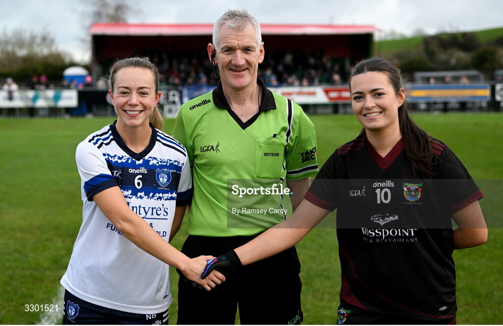 29 November 2025; Referee Philip Conway with captains Niamh Briody of Cavan Gaels and Mairín Duffy of Cromane before the AIB All-Ireland Ladies Football Club Junior Club Championship semi-final match between Cavan Gaels of Cavan and Cromane of Kerry at Terry Coyle Park in Cavan. Photo by Ramsey Cardy/Sportsfile